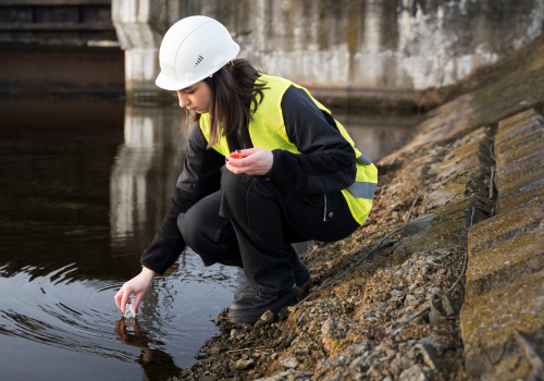 full-shot-environmental-engineer-getting-water-sample 1