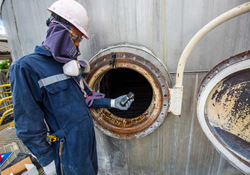 worker-hand-holding-gas-detector-inspection-safety-gas-testing-front-manhole-stainless-tank-work-inside-confined 1