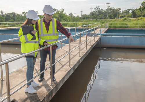 environmental-engineers-work-wastewater-treatment-plantswater-supply-engineering-working-water-recycling-plant-reusetechnicians-engineers-discuss-work-together 1